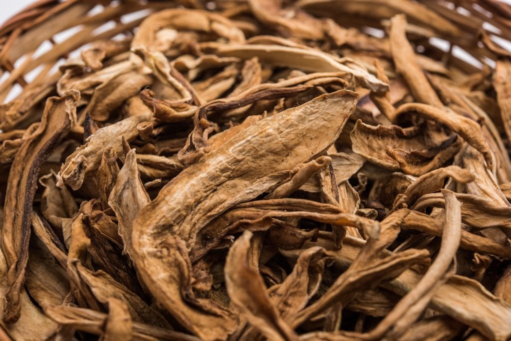 Dried green mango strips or kaccha aam or sookhi kairi or amchoor, selective focus