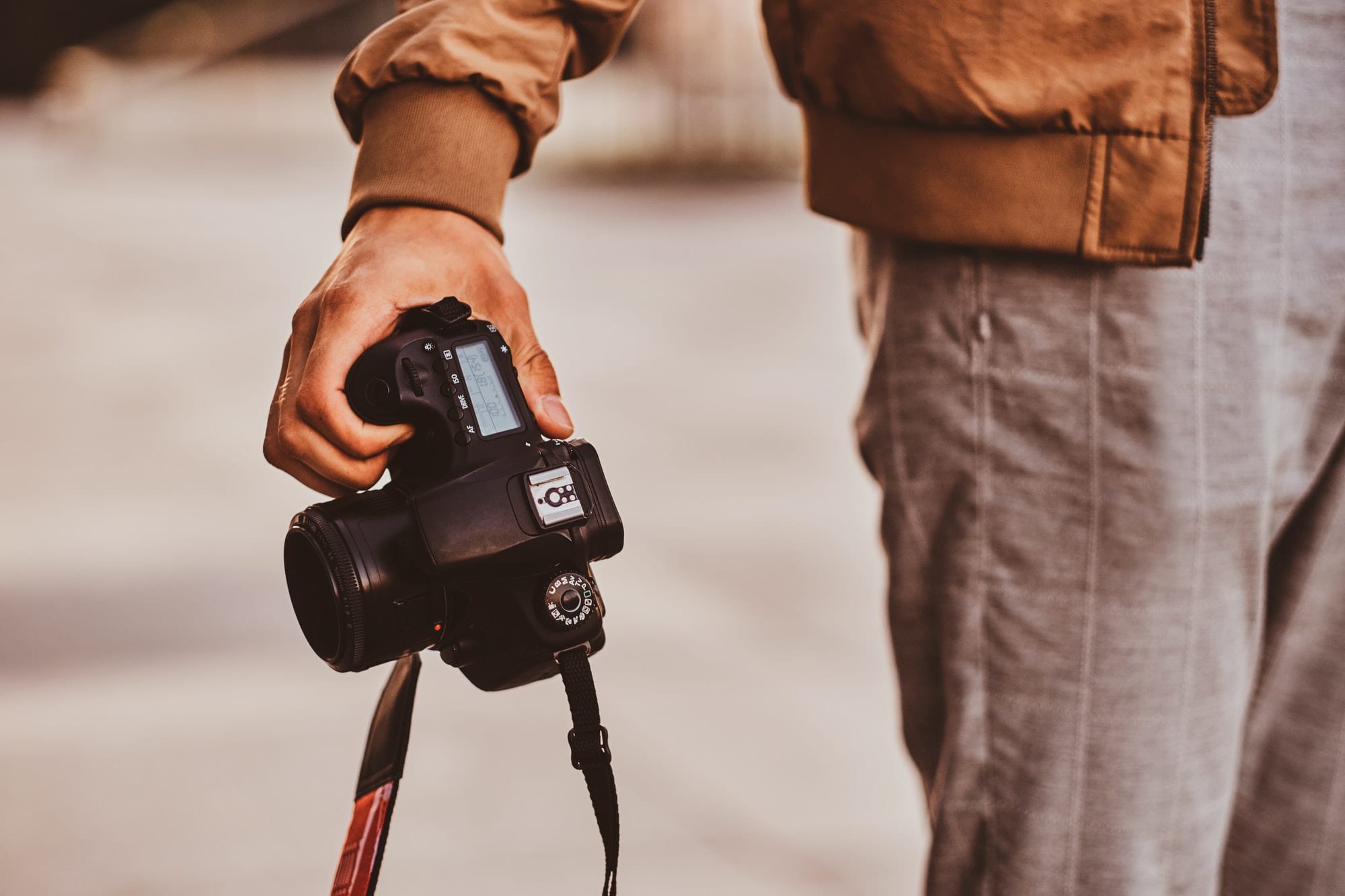 Man is carrying his digital photo camera