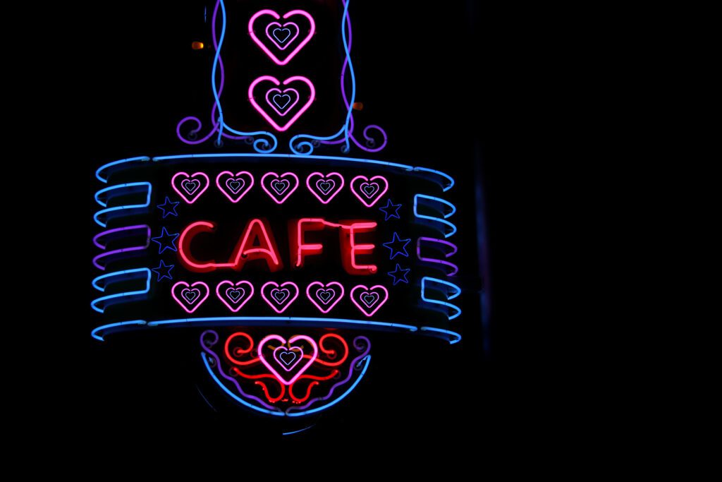Scenic shot of a vintage neon Cafe sign on a restaurant building